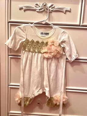 Baby girl outfit with gold and floral embroidery trim